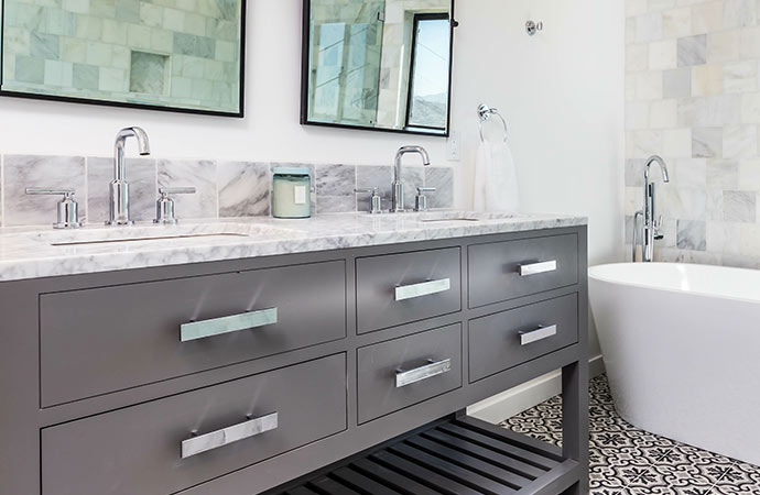 Simplify your bathroom with a skirted vanity and essential items in a remodeling project.