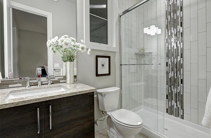 glass walk in shower in a bathroom of luxury home