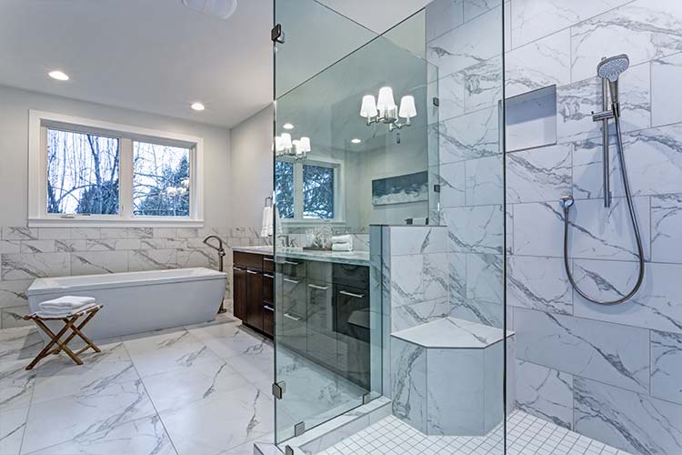 bathroom with carrara marble tile