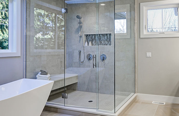 Upgrade your bathroom with a modern touch by installing a glass shower door.
