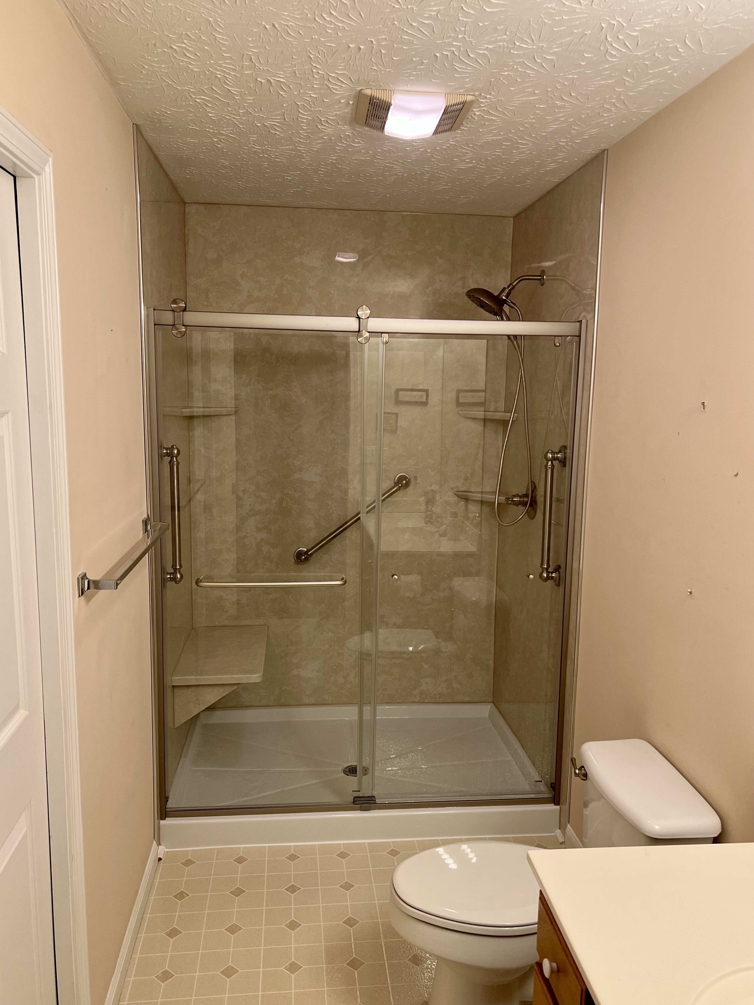 New walk in shower with custom glass doors