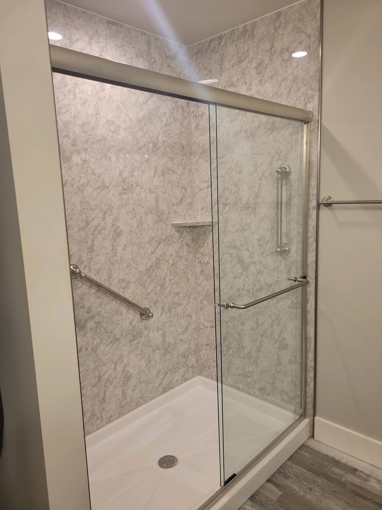 After, Artic Ice walls and white shower pan, beautiful glass doors 