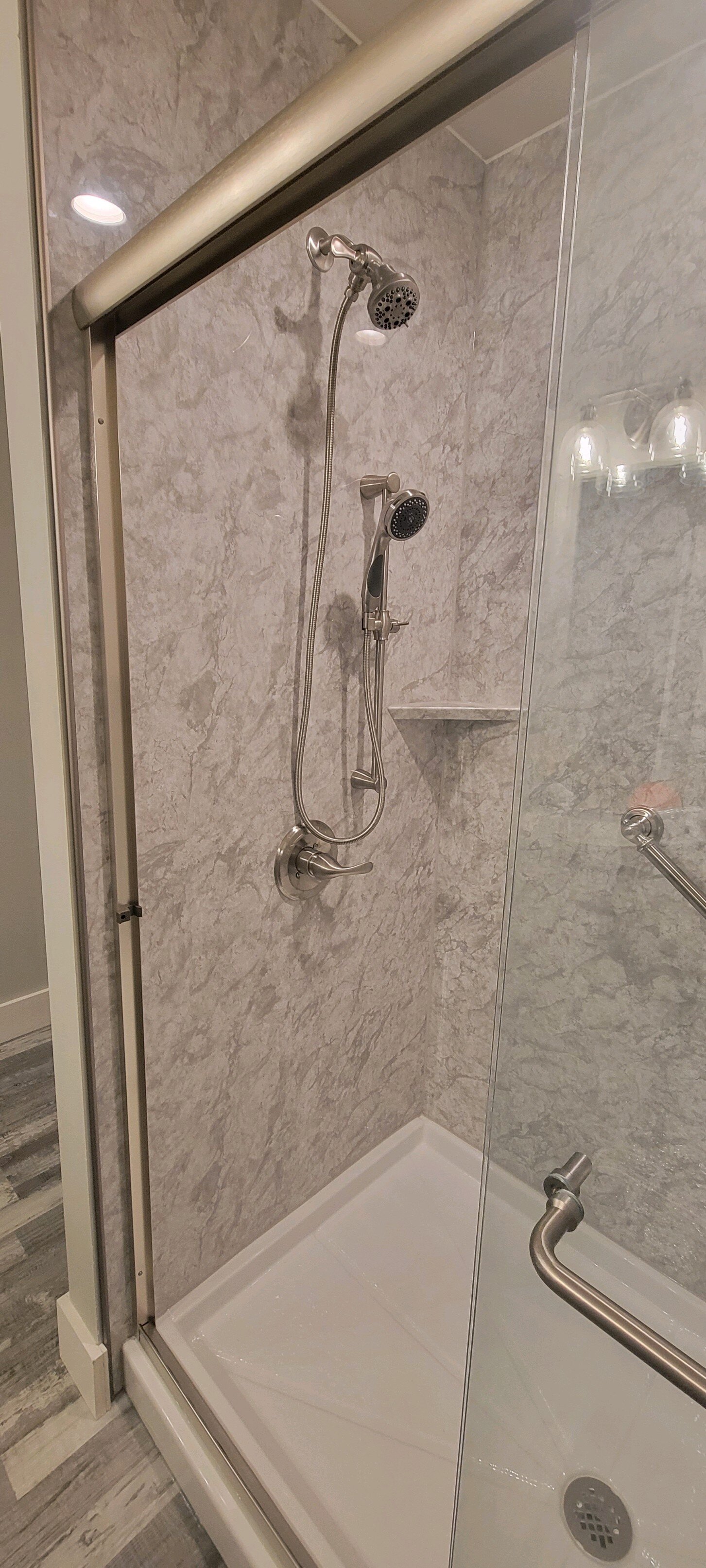 After, Mounted shower head and removable shower head in brushed nickle 