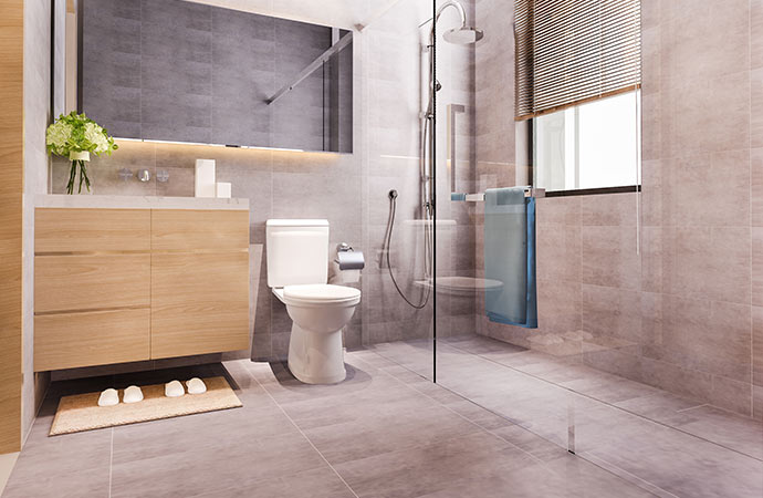 Embrace a natural look with laminate flooring for a stylish and inviting bathroom.