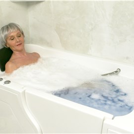 Woman taking bath in the walk in tub